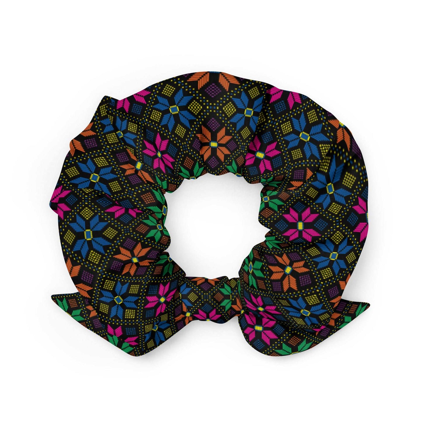 Synth Flower Recycled Scrunchie | Black Multicolor, a black scrunchie made of recycled materials with a bright pattern of pink, blue, orange, and green flowers with blue and yellow dots.