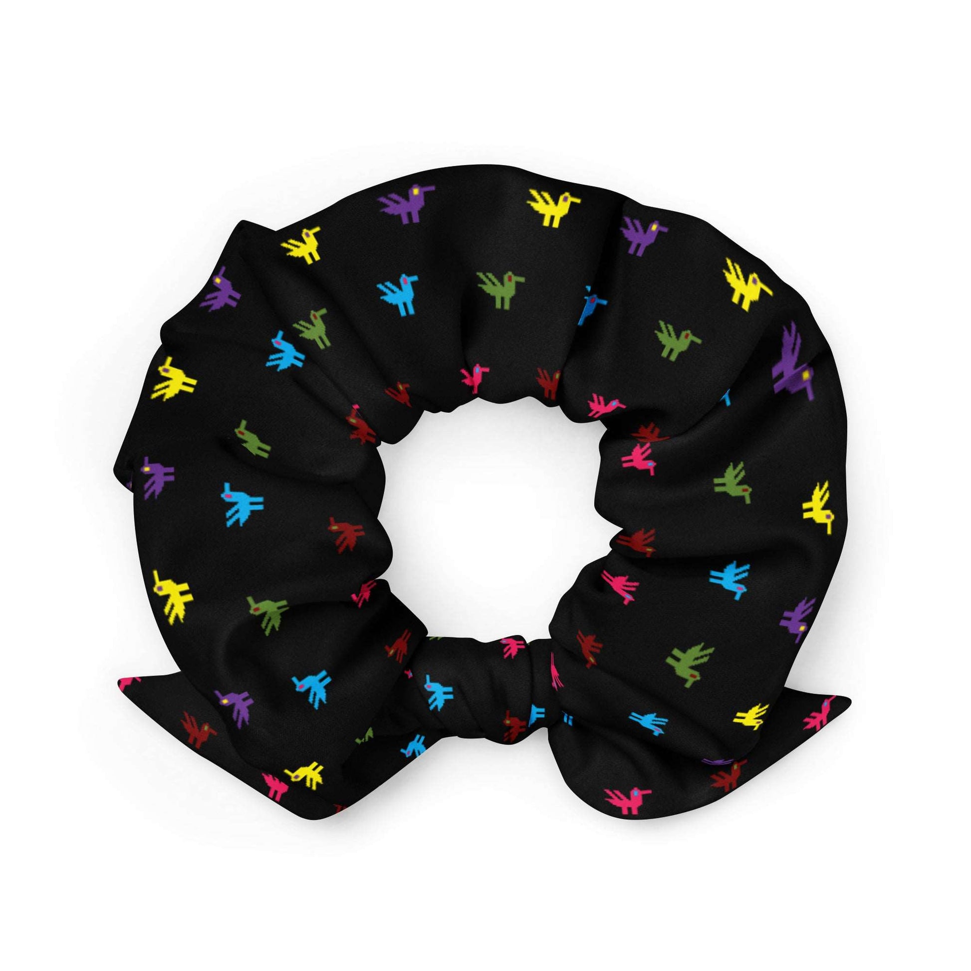 Little Ducks Recycled Scrunchie | Black Multicolor, a black scrunchie made of recycled materials with bright yellow, pink, blue, purple, maroon, and green ducks printed on it.