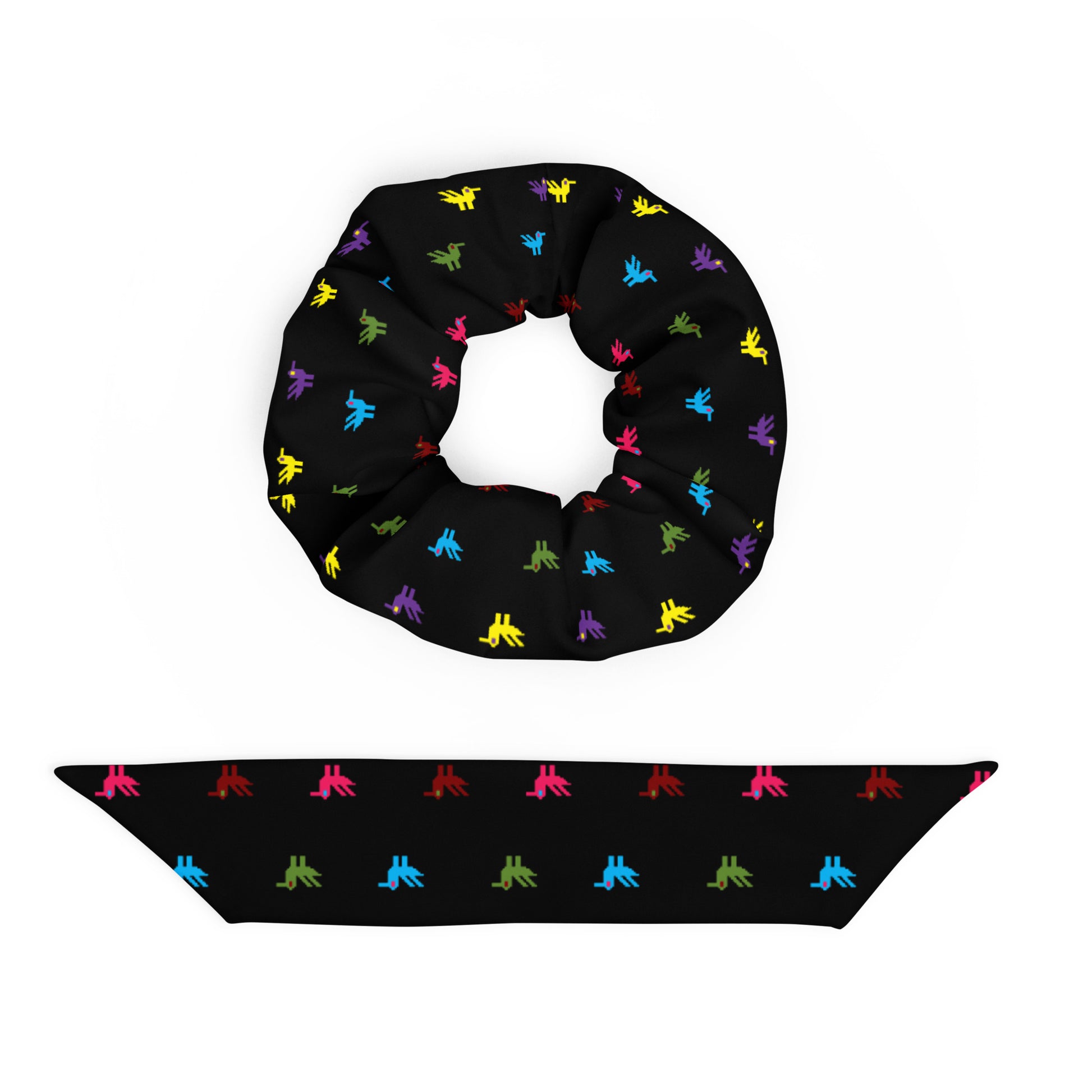 Little Ducks Recycled Scrunchie | Black Multicolor, a black scrunchie made of recycled materials with bright yellow, pink, blue, purple, maroon, and green ducks printed on it.