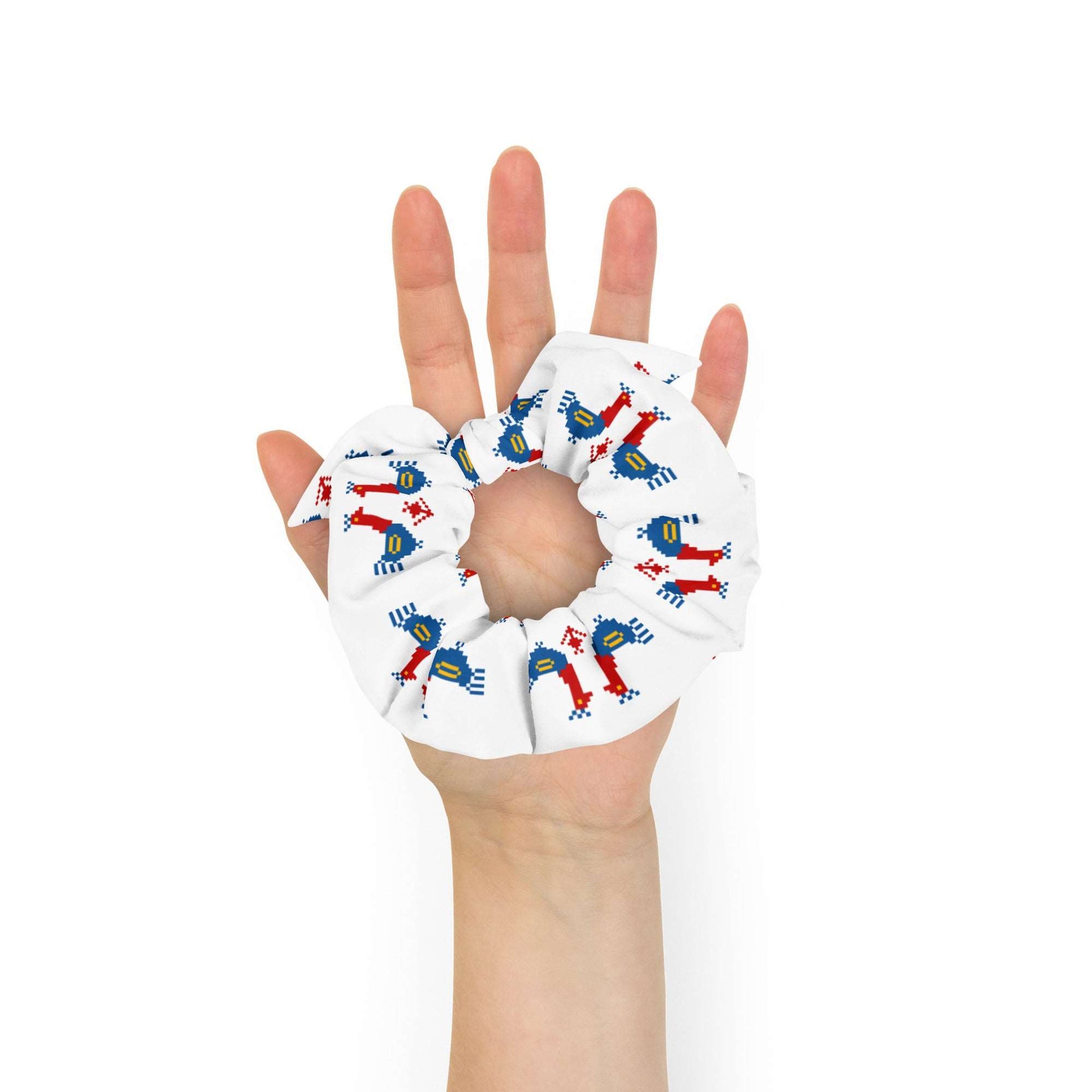 Roosters Recycled Scrunchie | White, a white scrunchie made of recycled materials with a pattern of large red and blue roosters with yellow details.