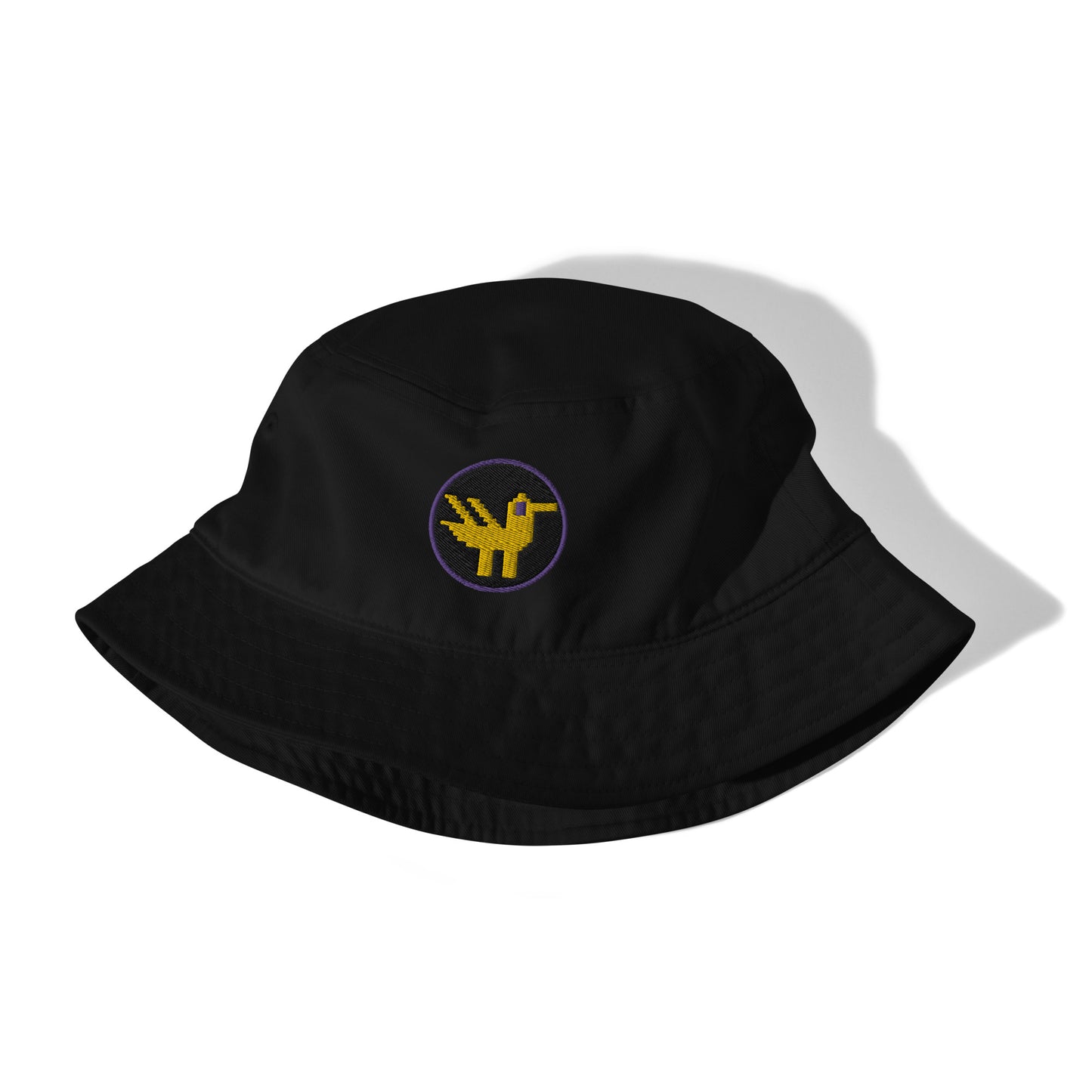 Duck Organic Bucket Hat. A black bucket hat made of 100% organic cotton with a large yellow duck with purple details embroidered on the front.