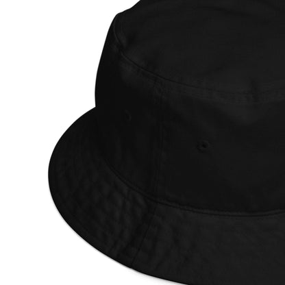 Detail of the rim of a black bucket hat made of 100% organic cotton.