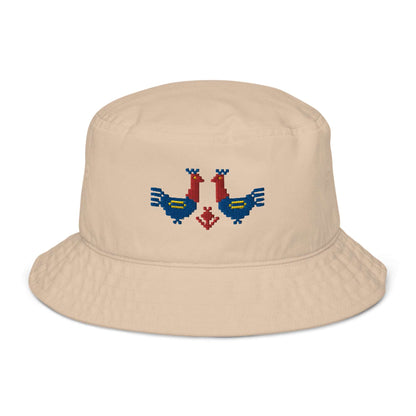 Roosters Organic bucket hat, a tan colored bucket hat with a pair of large red and blue roosters with yellow details embroidered on the front.