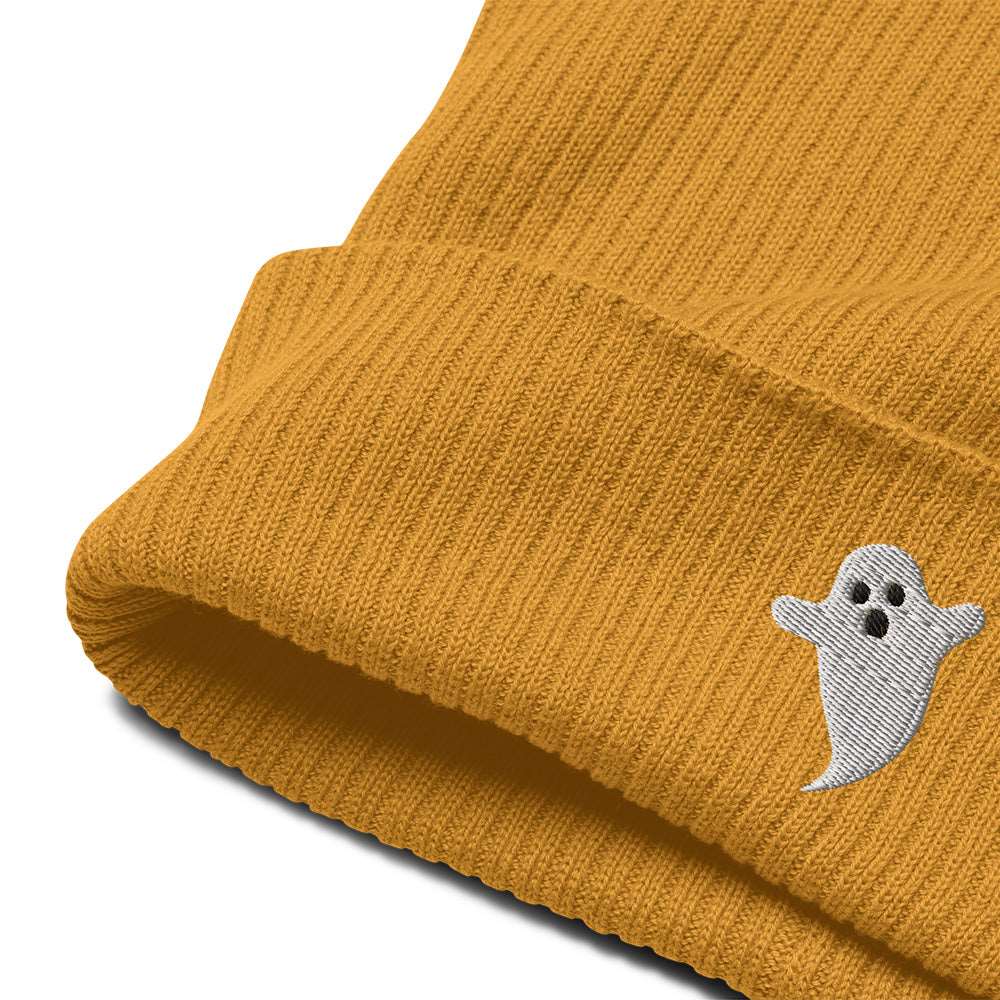 A close-up of a mustard yellow spooky Halloween ribbed beanie made of 100% organic cotton with a ghost embroidered on the front.