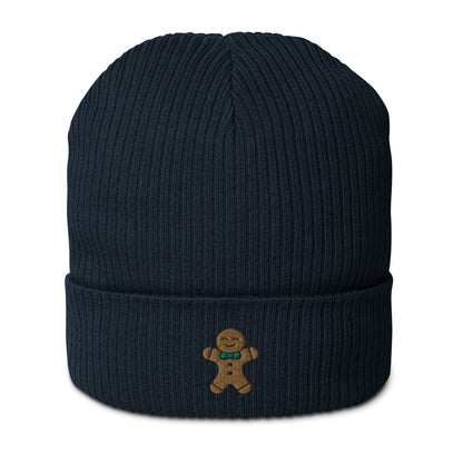 A navy blue ribbed festive holiday beanie with a gingerbread man embroidered on the front. The beanie is made of 100% organic cotton.