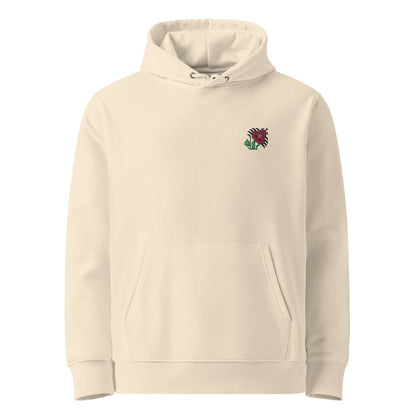 A light tan hoodie made of organic cotton and recycled polyester with an intricate pink flower embroidered on the top left.