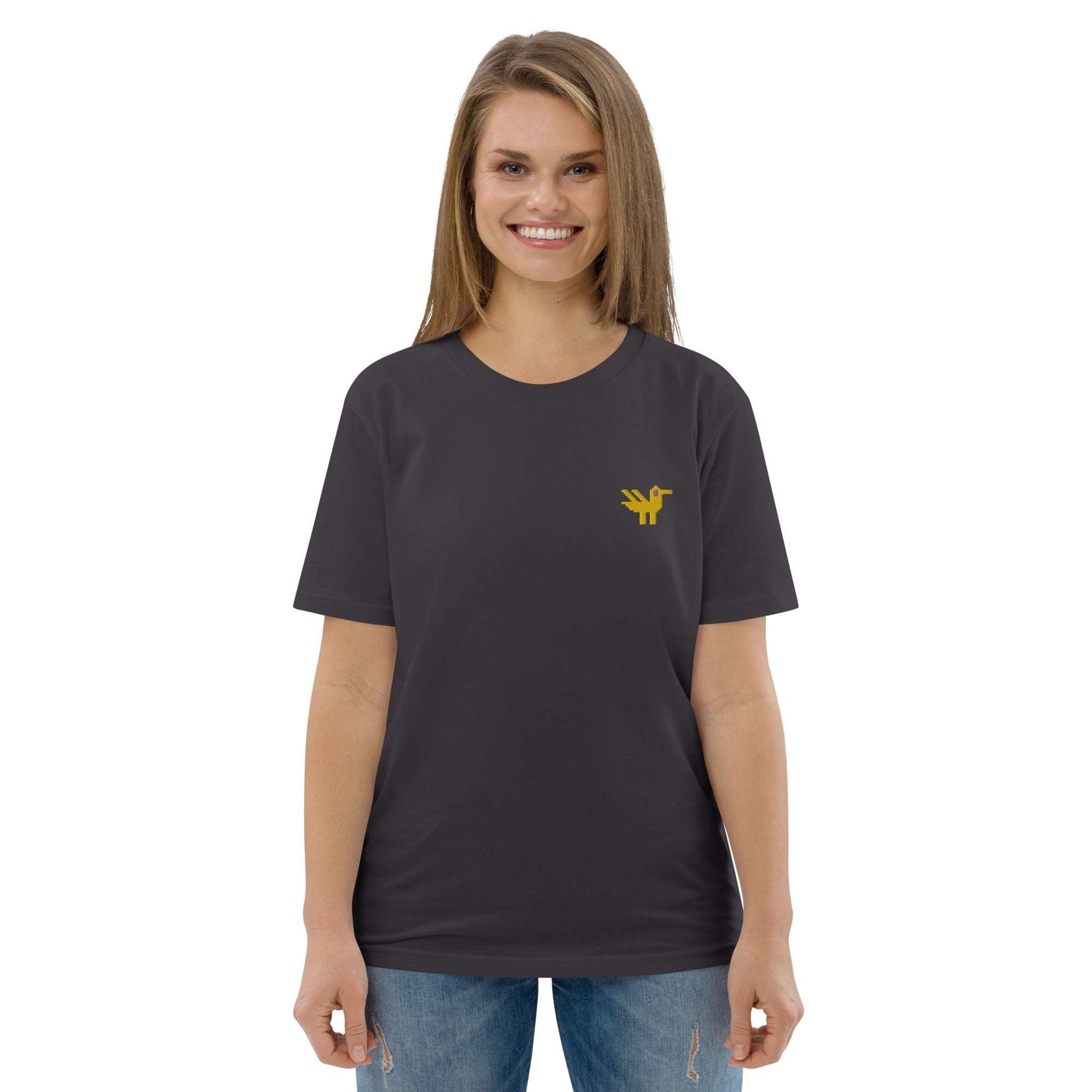 A woman wearing a dark grey t-shirt made of 100% organic cotton with a yellow duck embroidered on the top left.