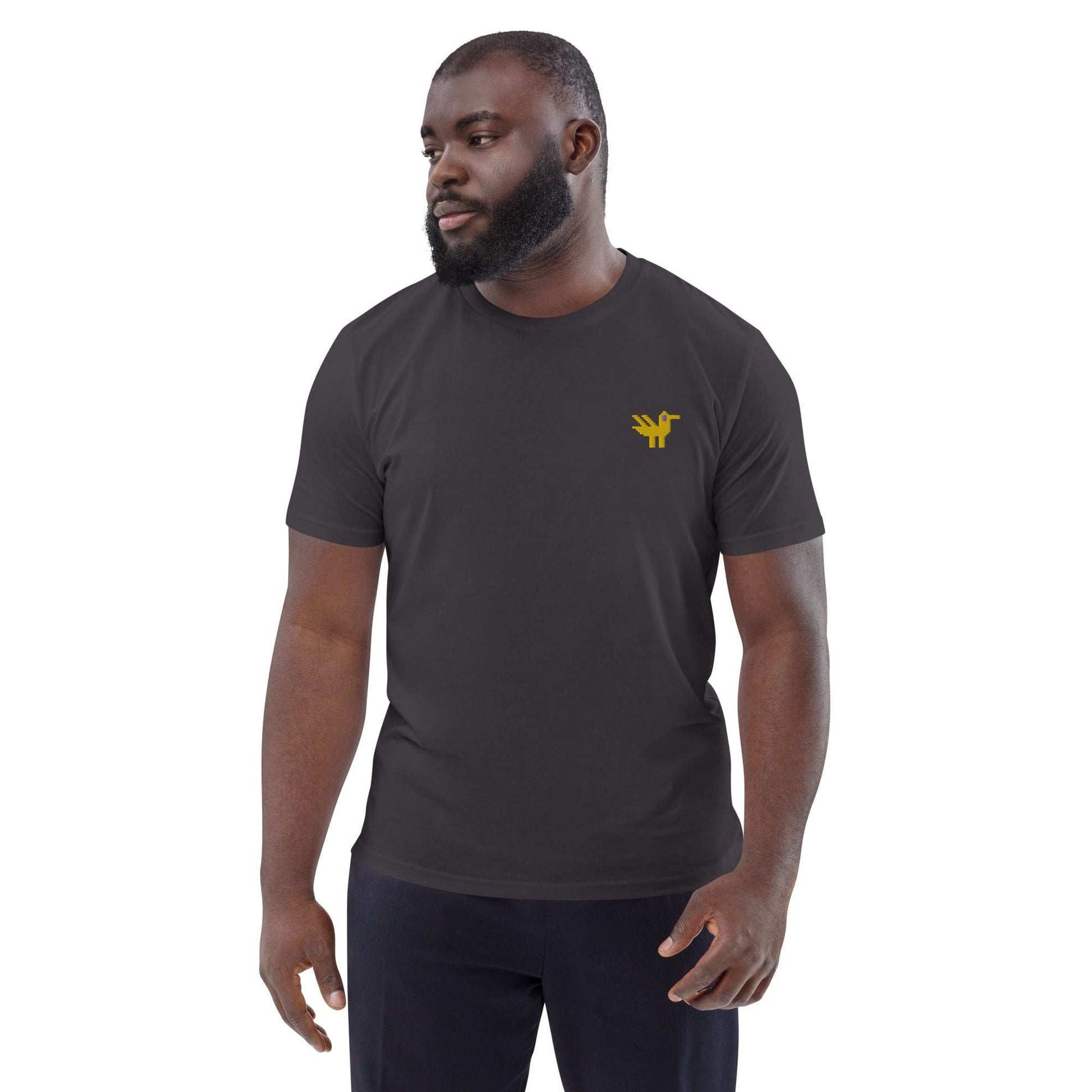 A man wearing dark grey t-shirt made of 100% organic cotton with a yellow duck embroidered on the top left.