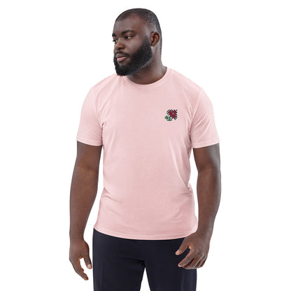 A man wearing a light pink t-shirt made of 100% organic cotton with an intricate pink flower embroidered on the top left.